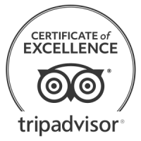 A black circular badge with &ldquo;CERTIFICATE of EXCELLENCE&rdquo; text, a pair of binoculars icon, and the word &ldquo;tripadvisor&rdquo; beneath, ending with a period.