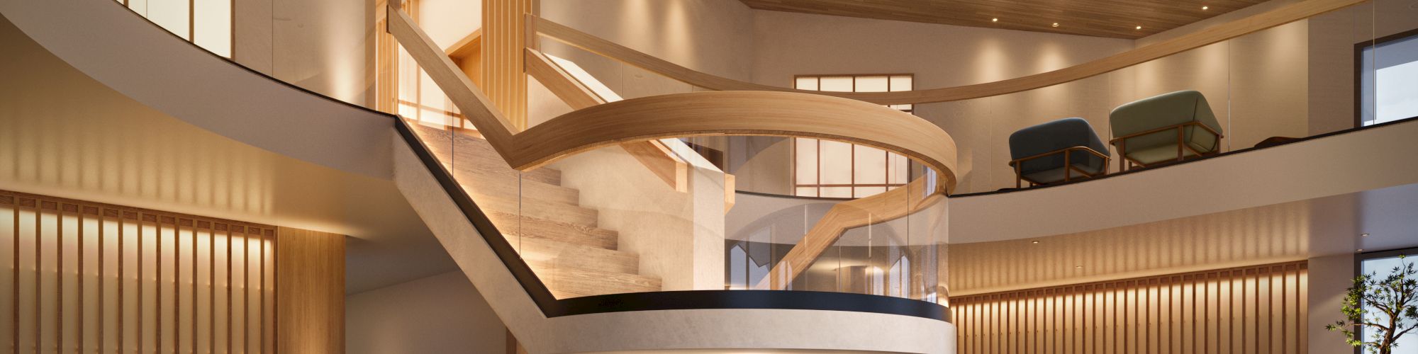 A modern, spacious lobby with a winding staircase, warm lighting, and stylish seating areas, creating an inviting ambiance.