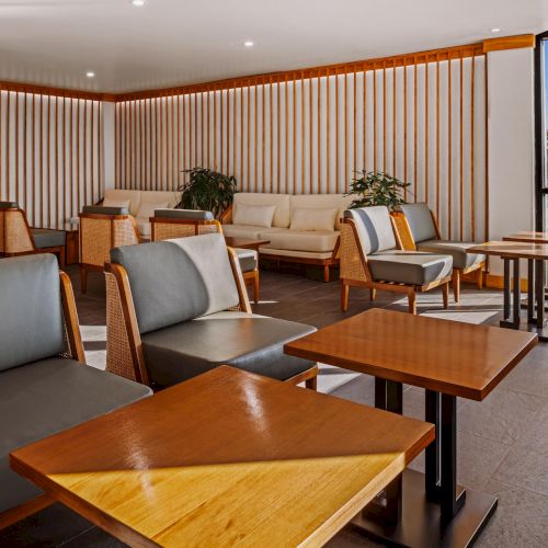 Interior architectural detail at The Amaya highlighting wood ceilings, glass partitions, and linear lighting