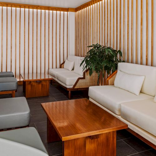 Architectural seating at The Amaya with vertical wood slats, skylight, and minimalist lines