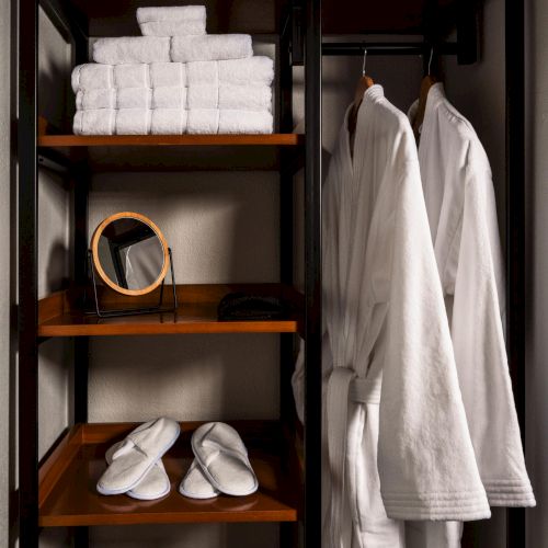 Plush robes arranged in a guest room at The Amaya, signaling a quiet transition from public space to private retreat