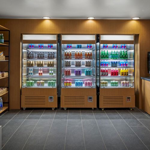 Nourish Market at The Amaya featuring curated beverages, snacks, and wood-framed refrigeration